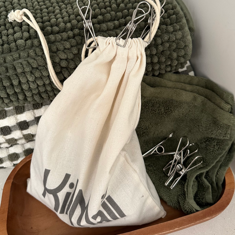 Stainless Steel Clothes Pegs pictured with Calico Clothes Peg Bag in laundry pictured on towels