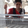 Artisan creating handwoven 100% organic cotton