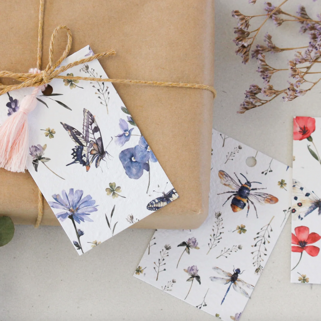 plantable gift tag that grows into daisies, butterflies, bees, flowers on wrapped gift