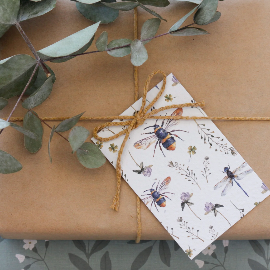 plantable gift tag that grows into daisies bees design on wrapped gift