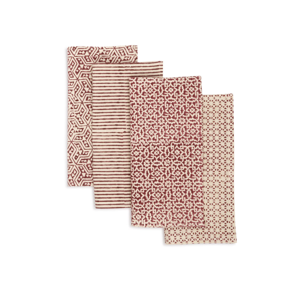 Cocktail size hand block printed napkins photographed on a blank background Garnet Forest colours