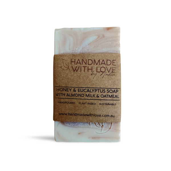 Handmade Honey Eucalyptus Soap wrapped in cardboard belly band and pictured on white backround