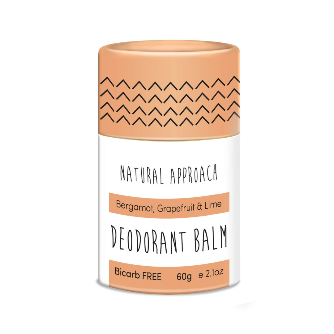 Deodorant balm container with peach-colored cap and label on a white background