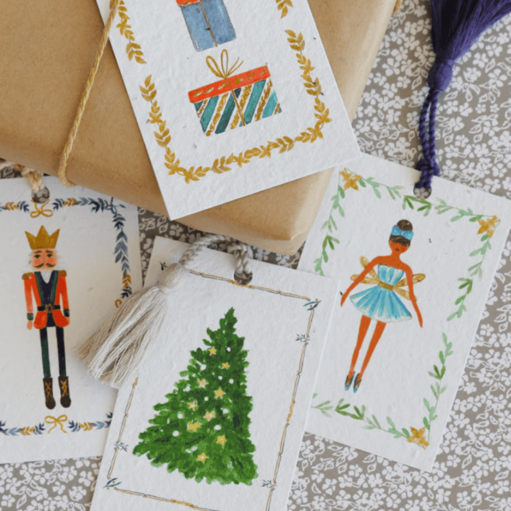 nutcracker plantable gift tags in four designs on wrapped gift