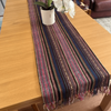 Handmade Table Runner Thailand laid out on wooden table with vase and orchid