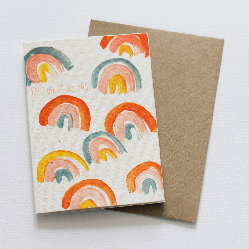 plantable seed card with bright rainbow swirls and the words keep on being you